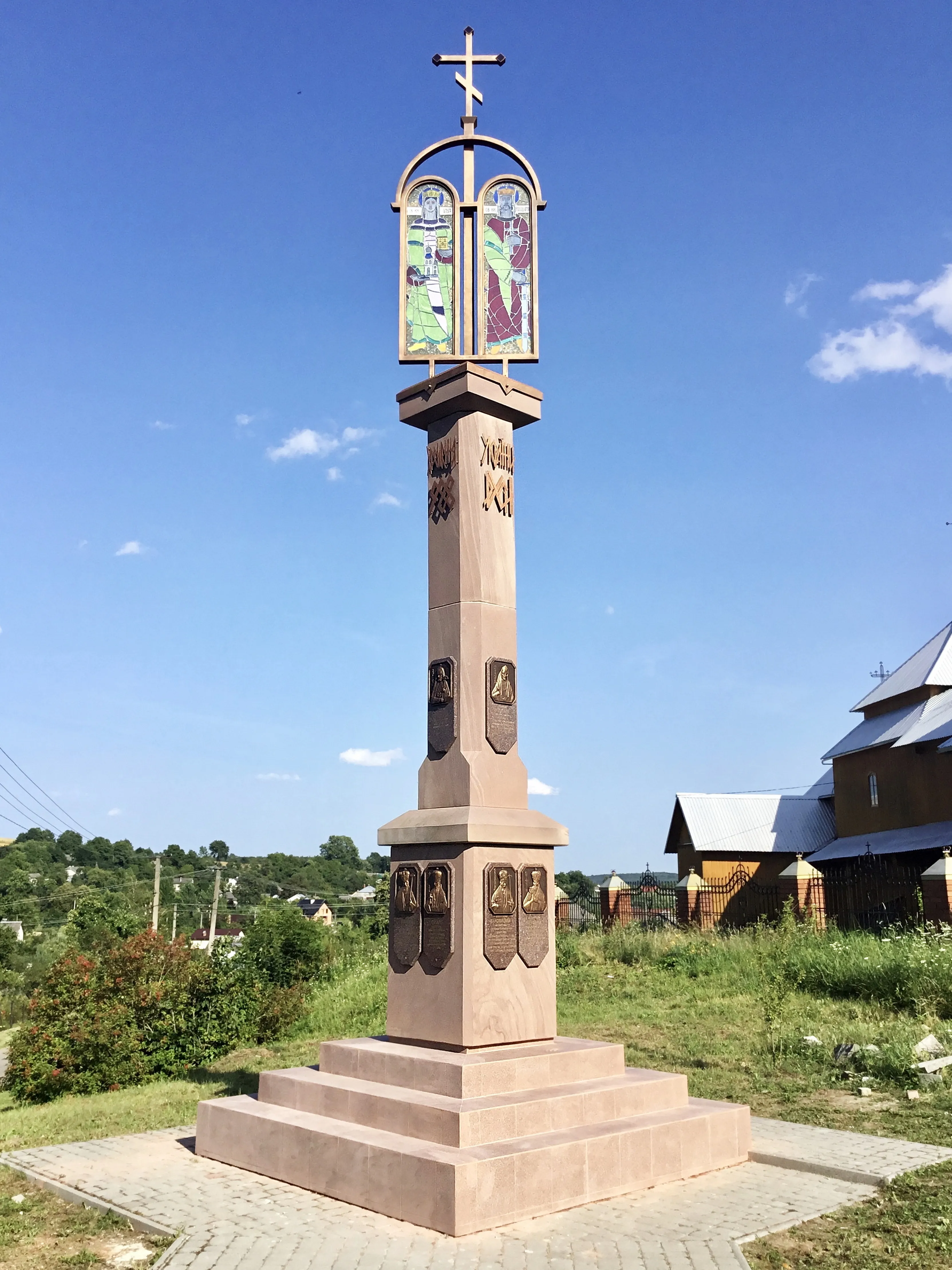 Image of Memorial sign to the granting of the Tomos of Autocephaly to the Orthodox Church of Ukraine by Roman Kykta, size: 8000/2700/2700 мм, made of Sandstone, granite, metal, glass, tinted polystone, Sculpture Monuments medium, from Vizhomlya village, Lviv region, Yavoriv district. Photo 1 of 9.